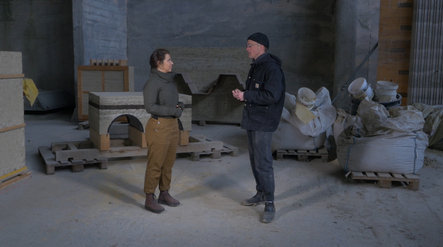 Image of two People talking together